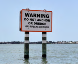 Warning Pipeline Sign